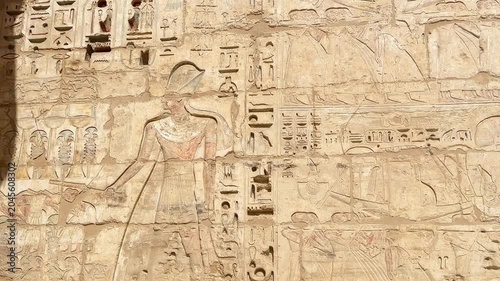 Beautiful bas-reliefs and ancient hieroglyphs from the mortuary temple of Ramesses III at Medinet Habu, Luxor, Egypt