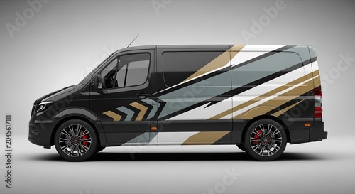 Modern vehicle wrap design on charcoal grey transport van.