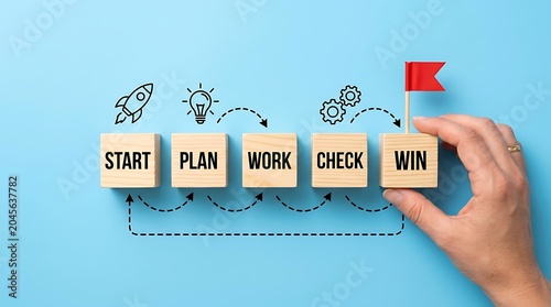 Hand placing WIN block in workflow process on blue background