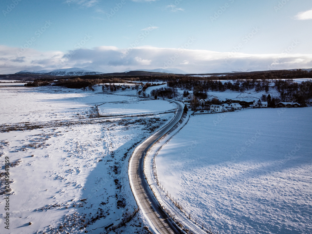 Fototapeta premium Aerial winter view of fields near Castle Roy, Nethy Bridge, Scotland