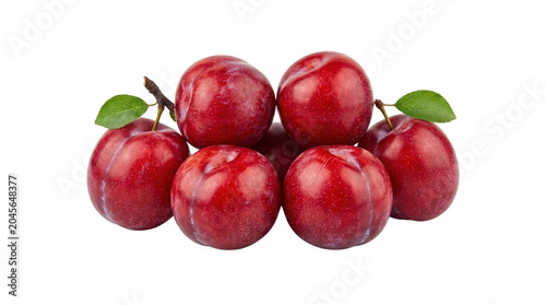 Fresh Ripe Red Plums with Green Leaves.