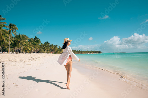 Woman enjoying tropical beach in Dominican Republic, Saona Island