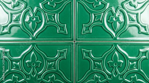 Close-up Ornate Moroccan Zellige Tile Pattern in Vibrant Emerald Green Geometric Design