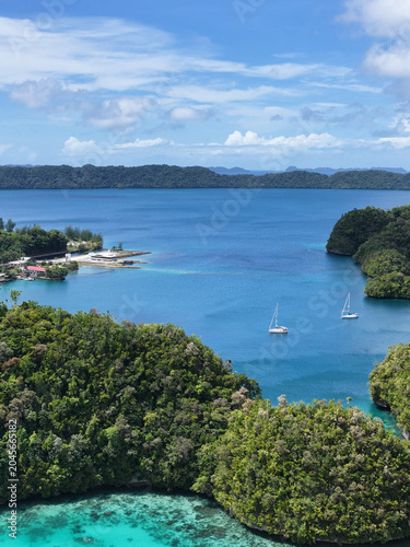 Fotografie Aerial View of Tropical Harbor with Sailboats and Limestone Karst Islands