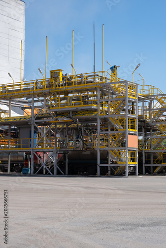 Industrial Power Plant with Steam Emissions and Blue Sky