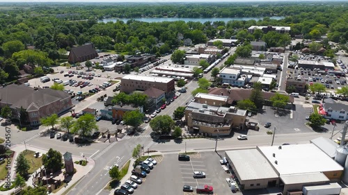 High-Angle Drone View of a Scenic Small Town Downtown Bordering a Quiet Lake