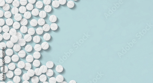 Foto White medical pills placed on light blue background view from top creating frame with copy space for text ideal for healthcare and pharmaceutical projects