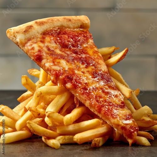 Stack of French Fries With a Slice of Pizza on Top at a Fast Food Restaurant