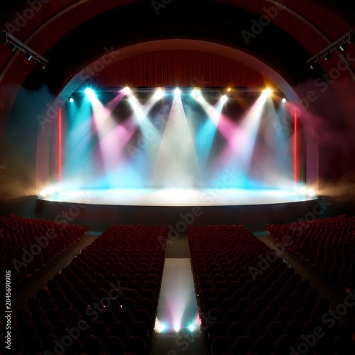 Colorful Stage Lights Shine Over a Runway in a Theater During an Evening Perf...