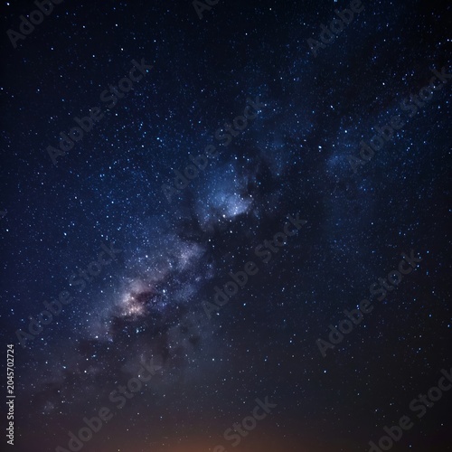 Stars Fill the Sky With Bright Points of Light Over a Dark Horizon at Night