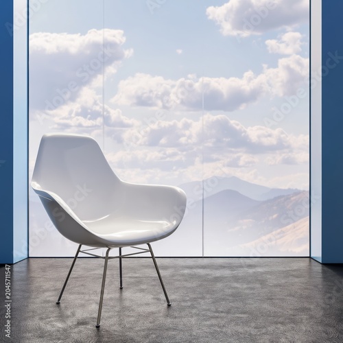 Modern Chair in a Bright Space With Large Windows Showing Mountains and Clouds