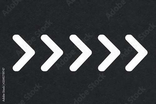 Forward Direction Arrow Chevron Symbols on Dark Textured Background