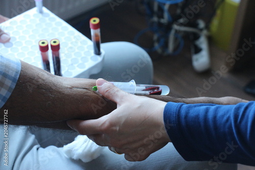 Photos Nurse Taking Blood Sample from Patient