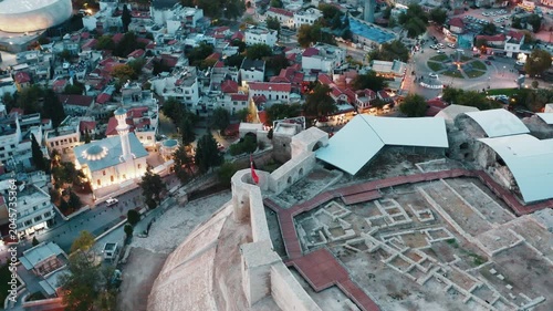 Aerial view of historical Gaziantep Castle and illuminated mosque at twilight