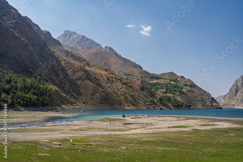 Scenic mountain landscape view of turquoise blue Marguzor lake in remote Seven Lakes aka Haft Kul, Shing river valley, Sughd, Tajikistan