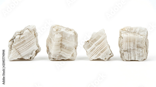 Four rough pieces of selenite crystal isolated on a white background