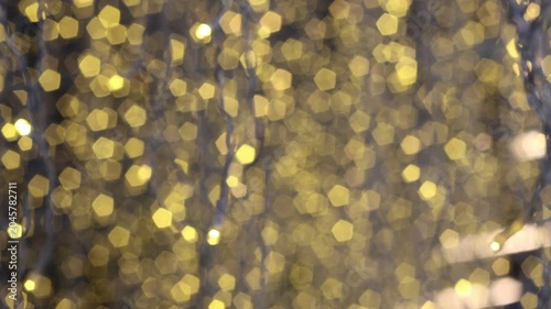 super blurry golden bokeh lights background. nice warm shiny circles shimmering for party design backdrop