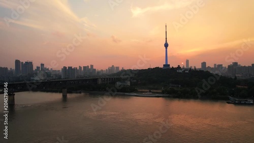 Wuhan China skyline at sunset with Yangtze River bridge and tower