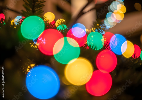 Colorful christmas tree lights in a festive holiday setting with blurred background