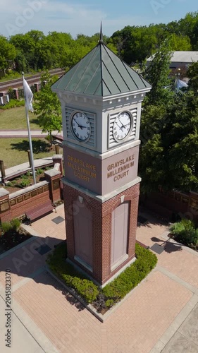 Architectural Landmark: Small Town Clock Tower Surrounded by Park Greenery