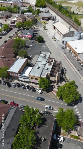 Vertical Drone Shot of a Vibrant Small-Town Downtown Area in Summer