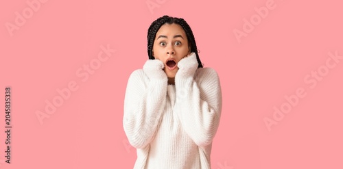 Surprised young woman in wh...
