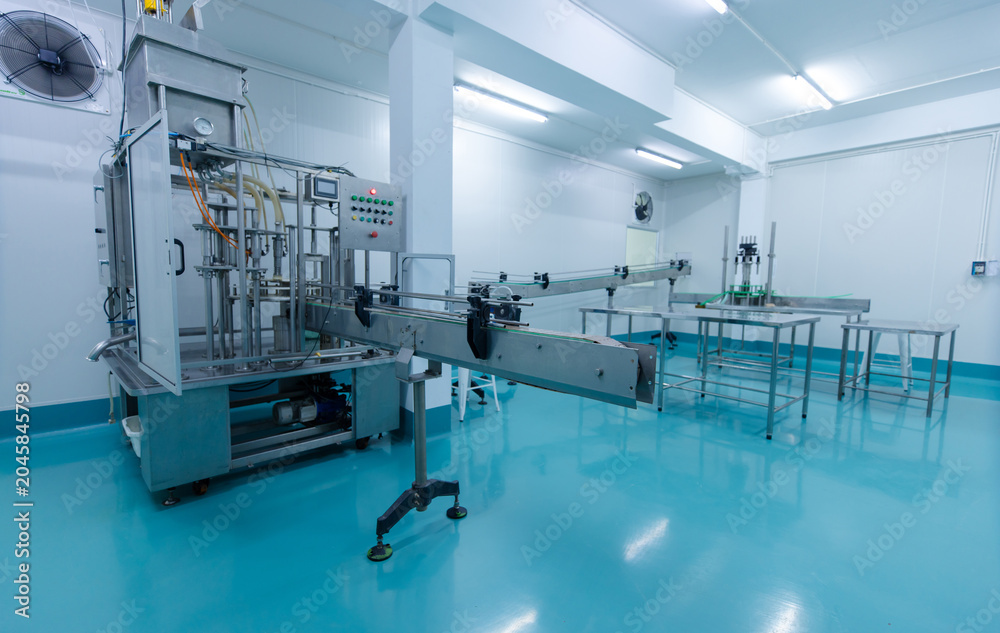 Fototapeta premium Clean industrial food processing room stainless steel conveyor machine sanitary production equipment automation modern factory interior designed packaging manufacturing operations technology quality.