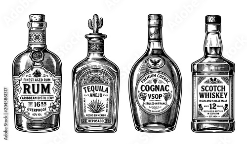 Fotografia Vintage Engraved Alcohol Bottle Collection Featuring Rum Cognac Tequila and Scot