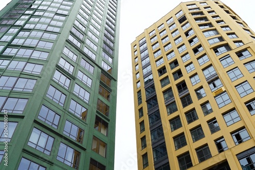 A couple of tall buildings that are next to each other