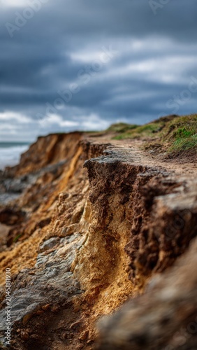 Dramatic Coastal Cliffside with Moody Sky