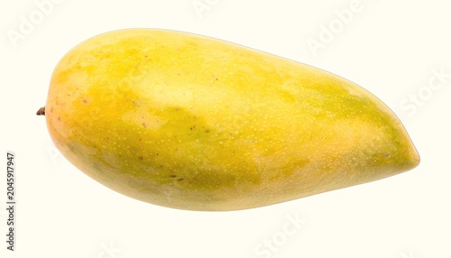 Ripe golden mango with smooth skin and green blush isolated on white background, tropical summer fruit photography