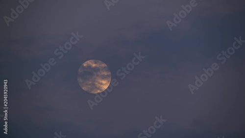 A bright full moon rising in the dark night sky over Shimen, New Taipei, Taiwan, captured during a clear evening.