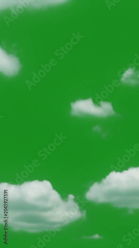 White cumulus clouds drifting across a vibrant green screen background, slow motion, representing weather, atmosphere, and digital compositing opportunities