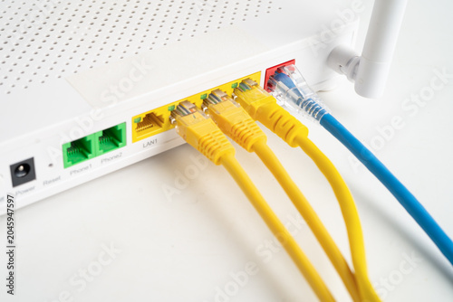 Obraz na płótnie Ethernet cable with wireless router connect to internet service provider network