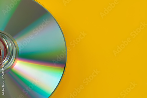 Cuadro en lienzo Top view of several CD discs for laser players they lie on a yellow background