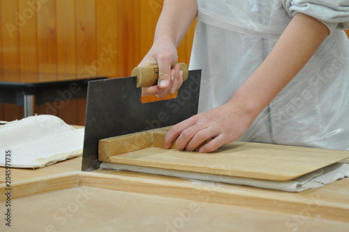 Japanese soba. Here, they are making and cutting the soba noodles.
