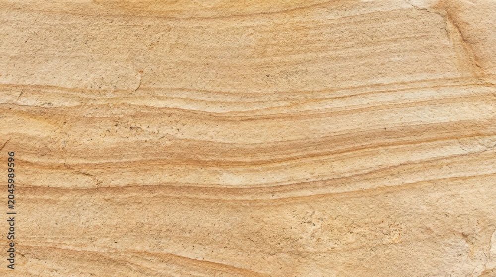 Fototapeta premium Warm sandstone texture with natural flowing bands