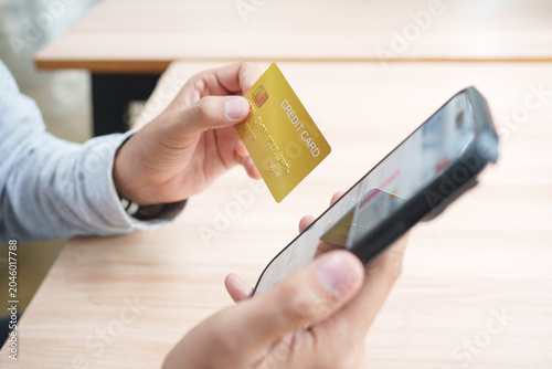 Картината върху платно Credit card used for secure online shopping payment and mobile checkout