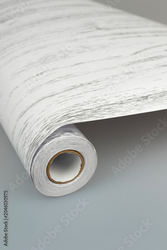 Roll of White and Gray Woodgrain Interior Film — Close-up Texture
