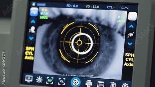 Eye test at an optometry clinic in the city showing a person operating a vision measurement device