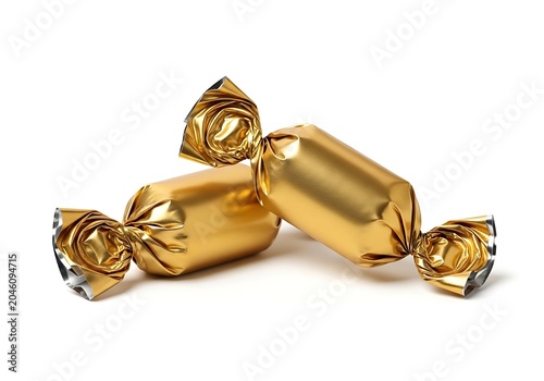 Two delicious sweet candies wrapped in shiny golden foil paper