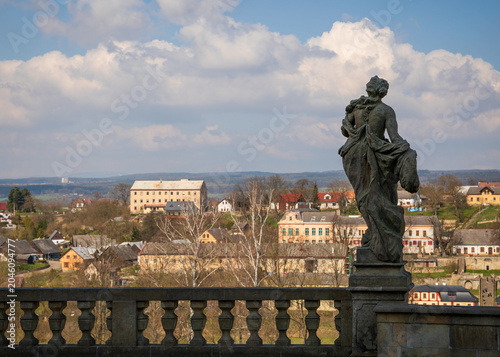 Kuks Hospital Baroque sculpture overlooking Czech village landscape