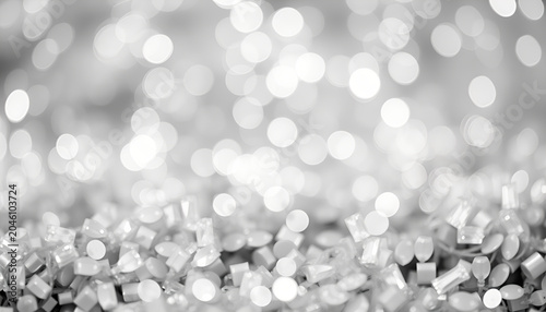 Glitter vintage lights background. silver and white. de-focused