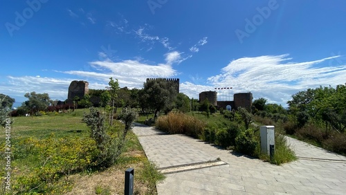 Front entrance of the historic Eskihisar Castle in Gebze, Kocaeli, Türkiye, featuring its ancient stone towers under a clear blue sky.