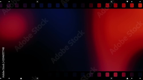 Vintage 35mm film strip background with vibrant red and orange light leaks flickering grain and scratches for retro cinematic video editing and nostalgic motion graphics