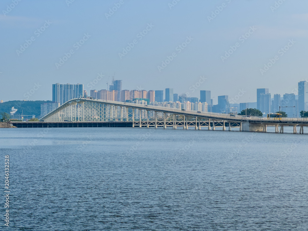 Fototapeta premium Bridge crossing over water way in Macau China 