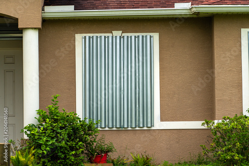 Foto Steel storm shutters for hurricane protection of house windows