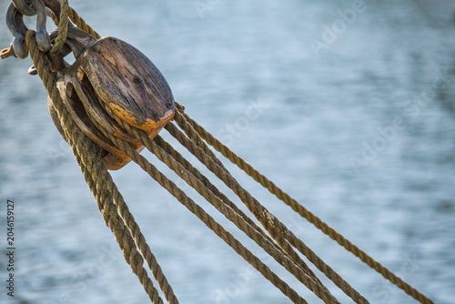Close-up of a pulley on an old sailing ship in a harbor on the Baltic Sea.