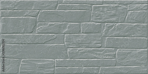 Obraz na płótnie A textured grey stone wall with irregular block pattern