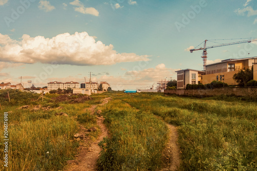 Urban Development and Construction Site with a water delivery lorry and a water tank in Syokimau, Kenya Under a Sunny Sky